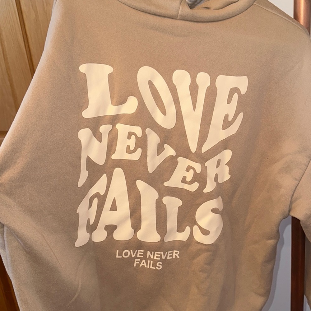Love Never Fails Sweatshirt